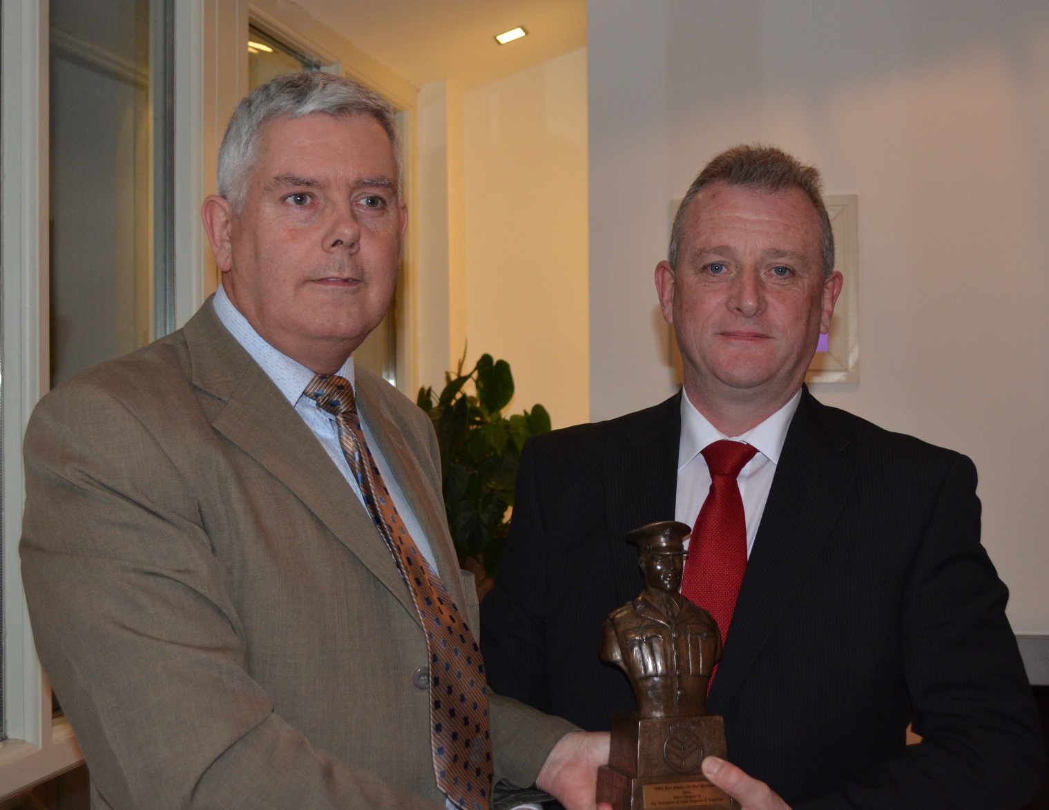 John Jacob makes presentation to Phillip Farrell Blessington on his retirement